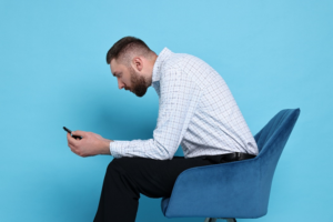 a person sitting slouched in a chair