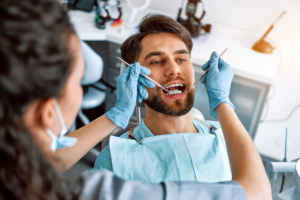 a patient with braces visiting his orthodontist 